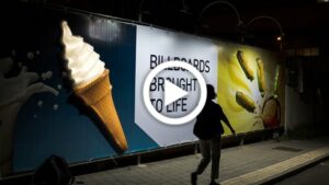 An image of a billboard taken in the dark, showcasing an illuminated ice cream cone, displaying the capabilities of additive manufacturing 