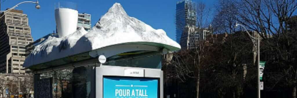 Bus stop topped with ice berg design created by 3d printer for advertising purposes