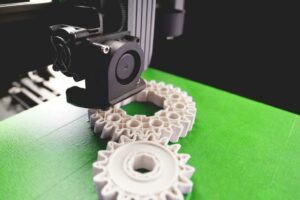 A 3D printing head printing an intricate part 
