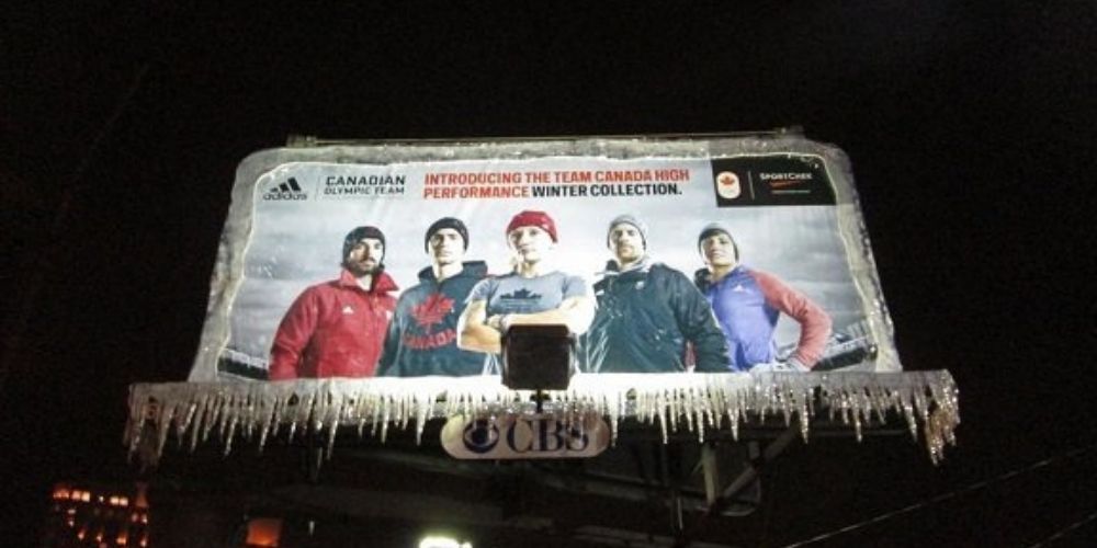Image of a billboard at night features team Canada with seemingly realistic icicle elements "dripping off" the billboard.