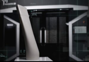 An image of a duct mandrel in front of a Massivit 3D printer