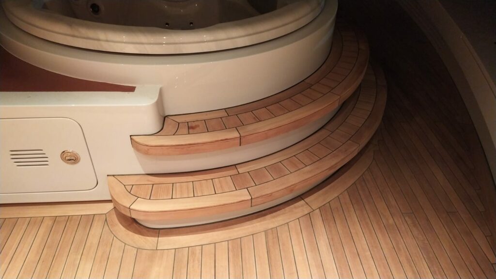 A view of a teak deck up-close, provided by Woltz Nautic